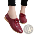 Genuine leather pointed toe women flats in burgundy with soft pebbled texture and light beige lace-up soles
