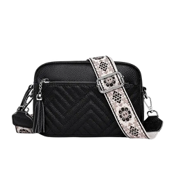 Genuine leather quilted black crossbody bag with floral-patterned strap silver hardware and tassel details leather handbags