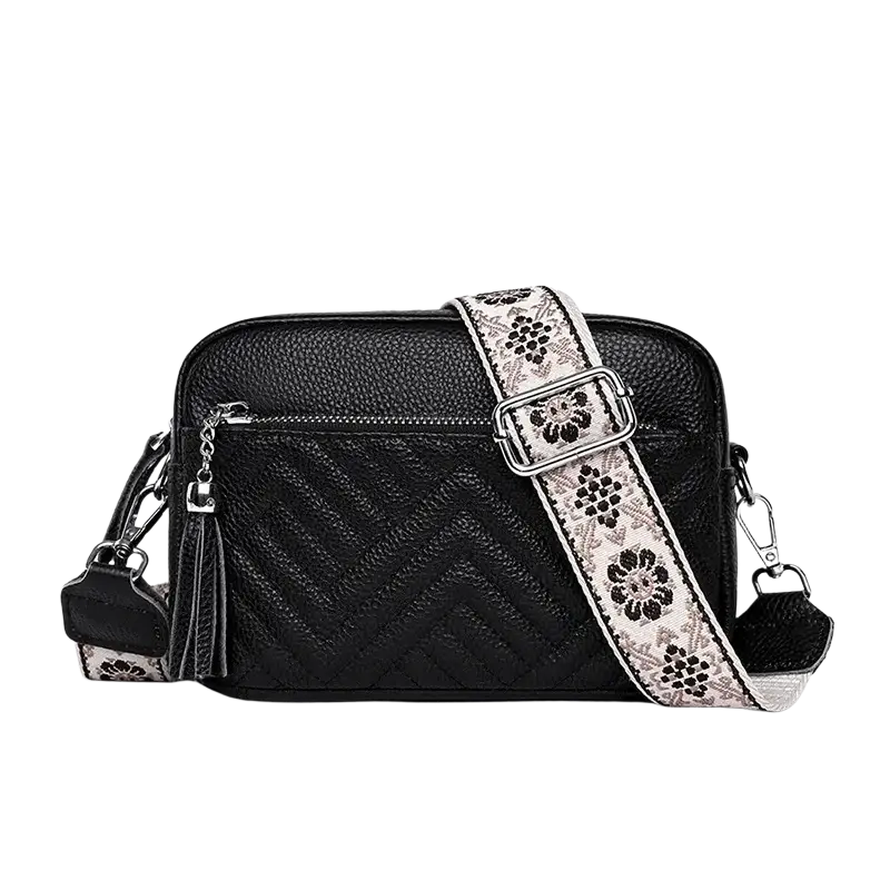 Genuine leather quilted black crossbody bag with floral-patterned strap silver hardware and tassel details leather handbags
