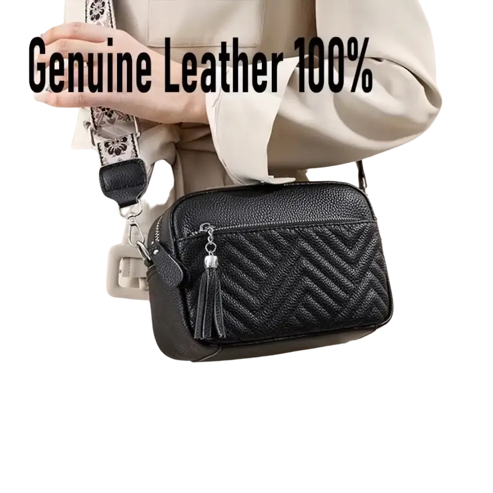 Black quilted genuine leather crossbody bag with decorative tassel and patterned strap for stylish use