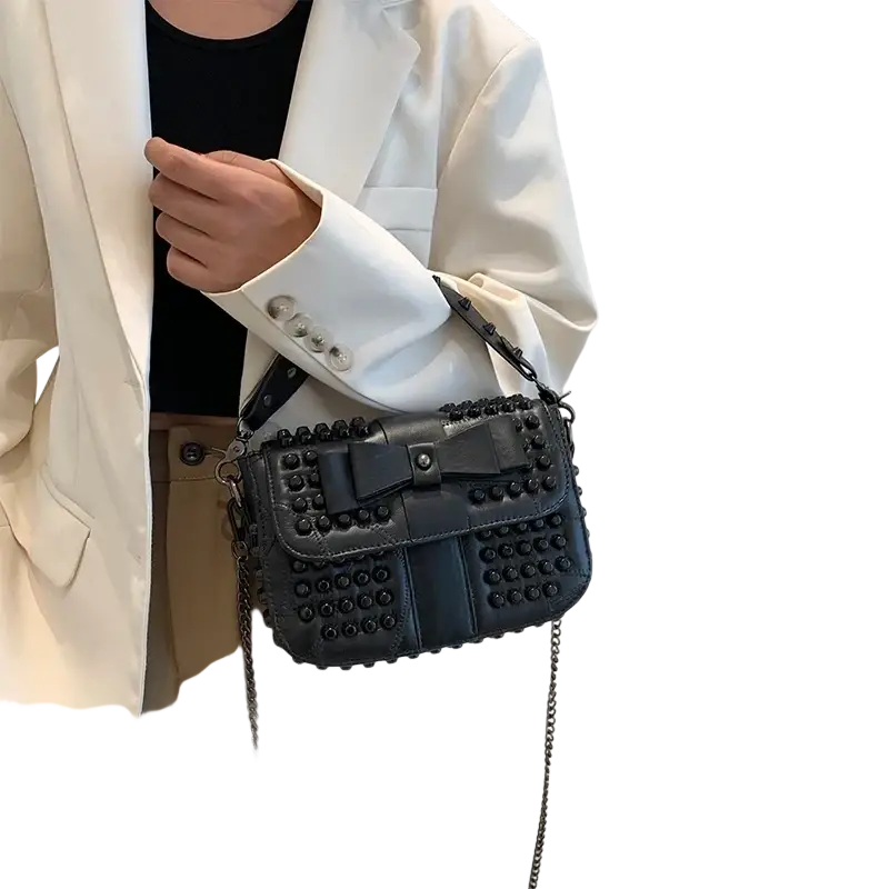 Black studded genuine leather shoulder bag with central bow detail and phone pocket for everyday use