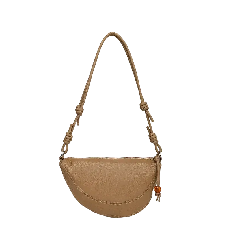 Tan genuine leather crescent crossbody shoulder bag with pebbled texture knotted strap and amber bead tassel