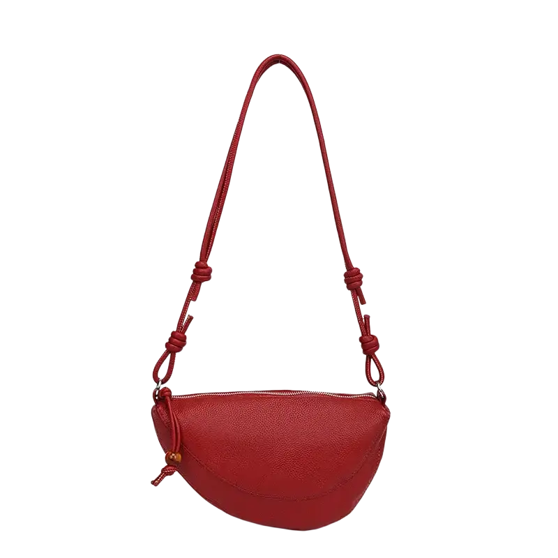 Genuine leather shoulder bag in vibrant red with textured leather and knotted strap details for versatile use
