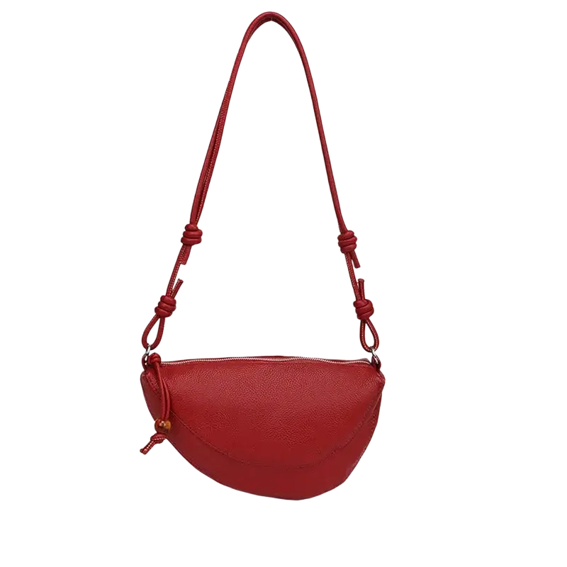 A vibrant red genuine leather shoulder bag with textured design knotted strap and wooden toggle crossbody handbag
