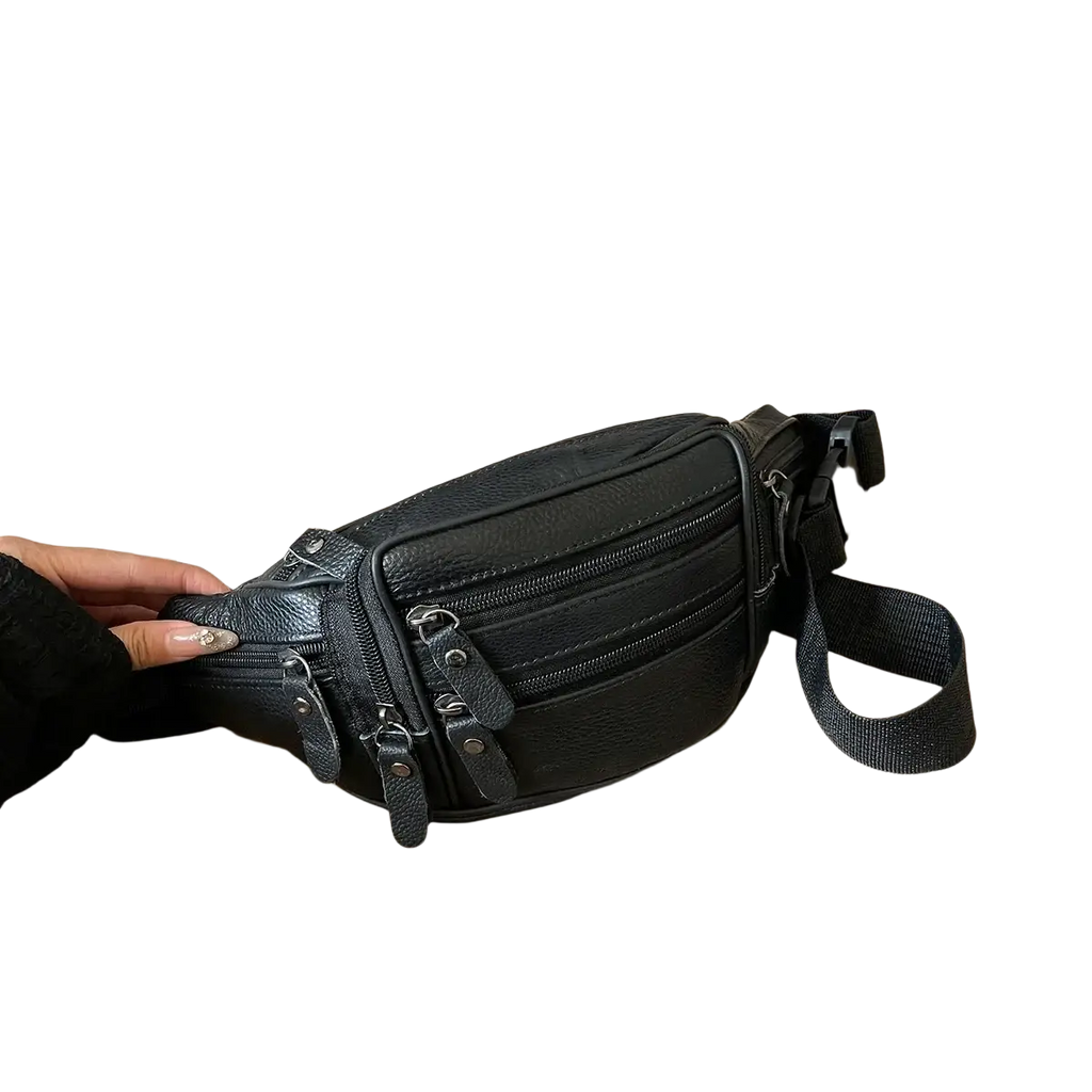 Black genuine leather waist bag with multiple zippers and adjustable strap for crossbody or fanny pack use