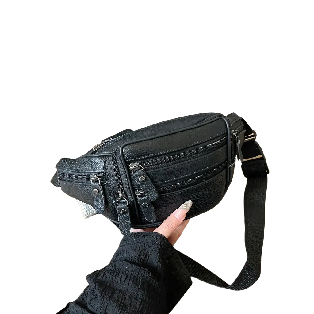 Black genuine leather waist bag with multiple zippers and adjustable strap for versatile crossbody use