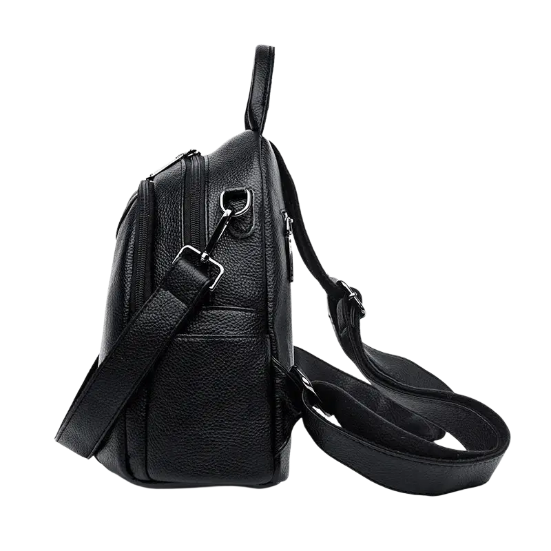 Black genuine leather women travel backpack with textured exterior and adjustable shoulder straps showing pocket interior