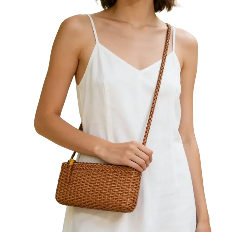 Genuine leather woven shoulder bag in brown rattan with braided strap and gold-tone hardware for stylish use