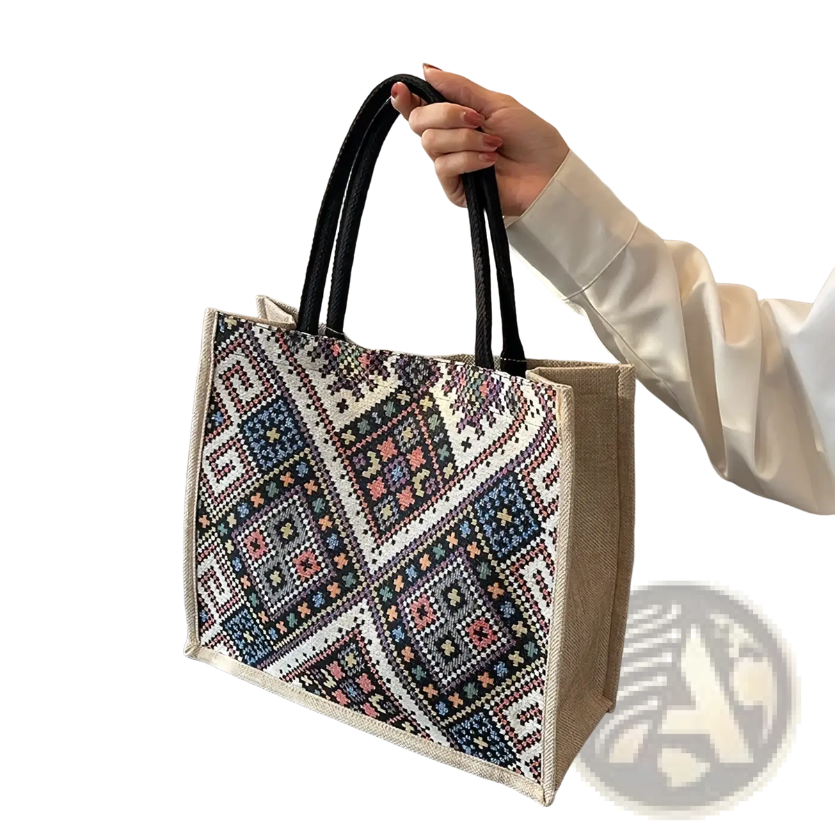 A beige jute geometric canvas tote bag with black handles and colorful floral motifs for casual commuting