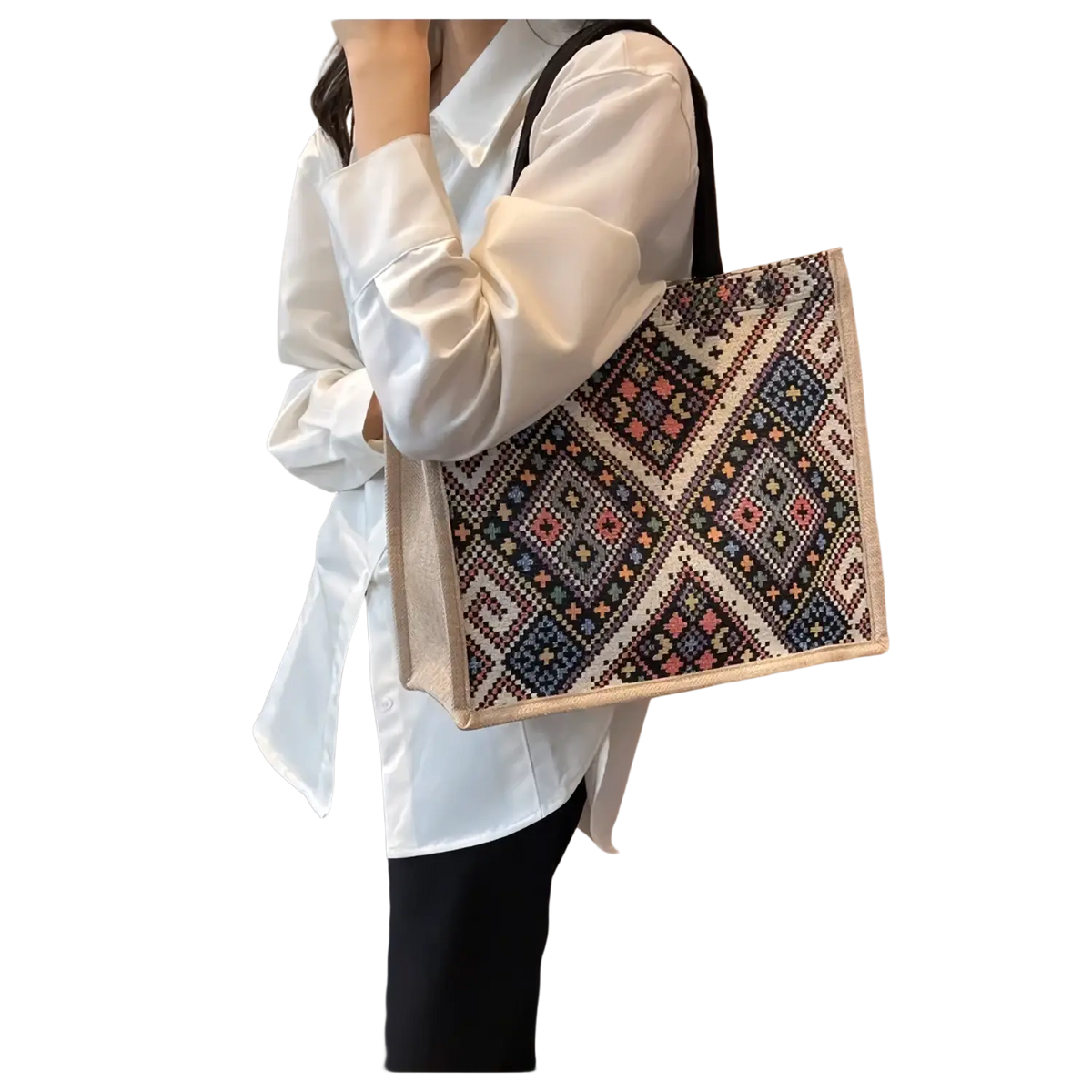 A woven large casual commuter tote bag with a colorful black red blue and beige geometric canvas pattern