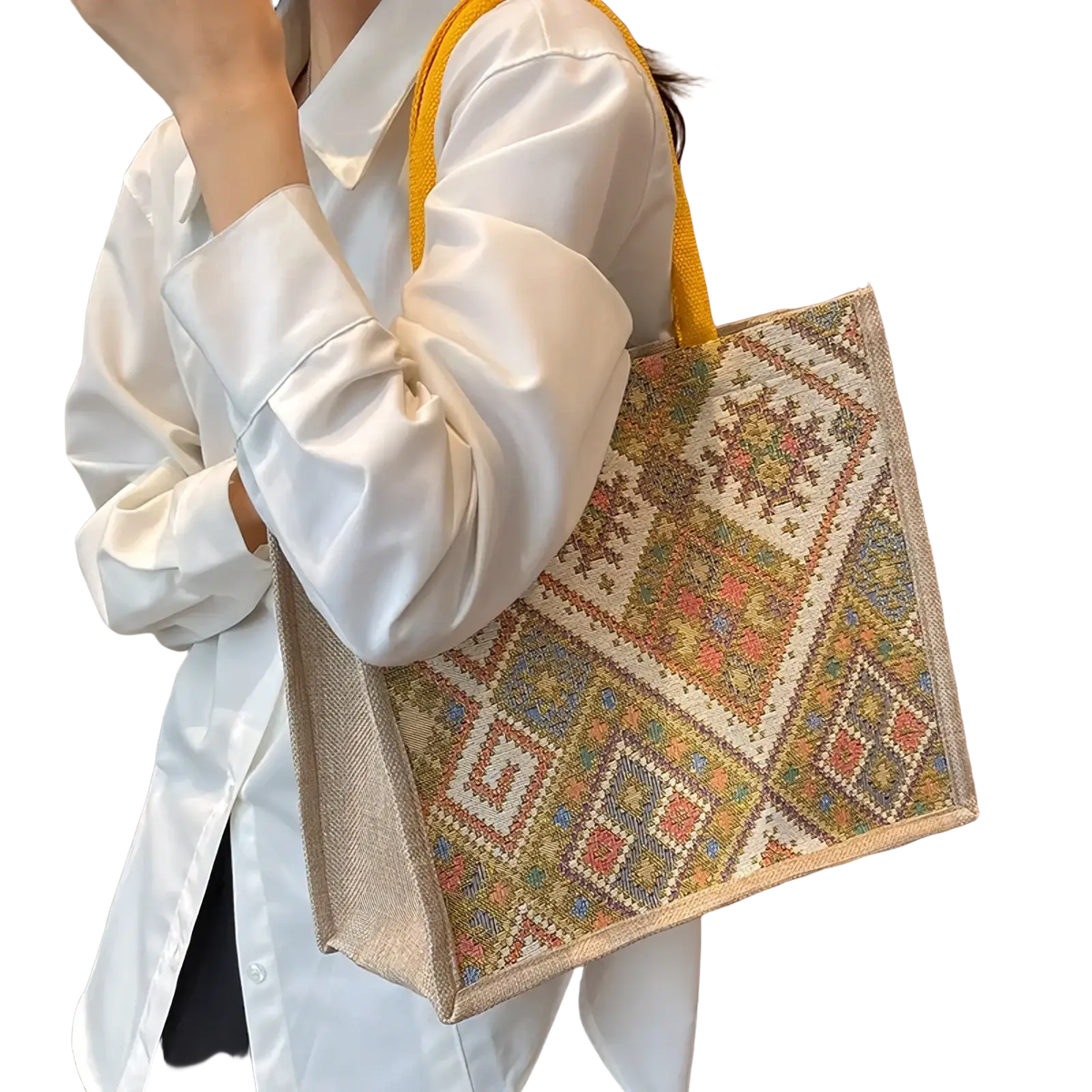 A large geometric canvas tote bag with earthy tones bright accents and sturdy yellow handles for casual commuting