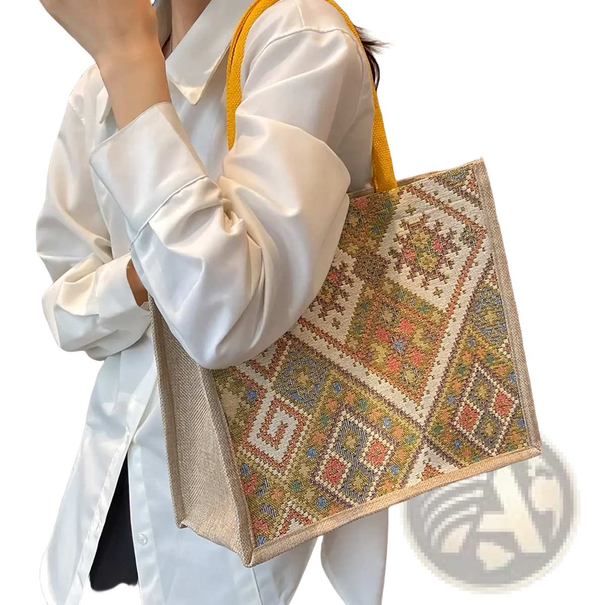 A large geometric canvas tote bag with earthy tones bright accents and sturdy yellow handles for casual commuting