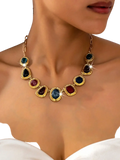 Geometric gemstone pendant necklace for women with gold-toned chain and blue red and black oval and teardrop gemstones