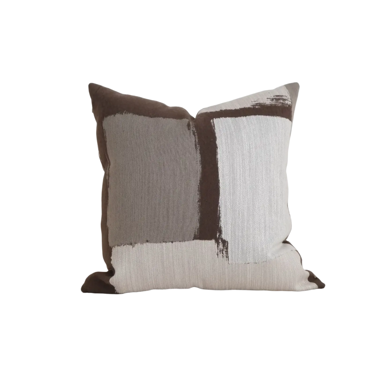 A square cushion cover in brown maillard with geometric jacquard bold brushstroke patterns on textured fabric
