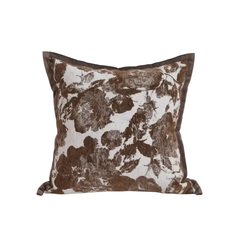 Brown maillard geometric jacquard cushion cover with brown and white floral pattern and textured fabric finish