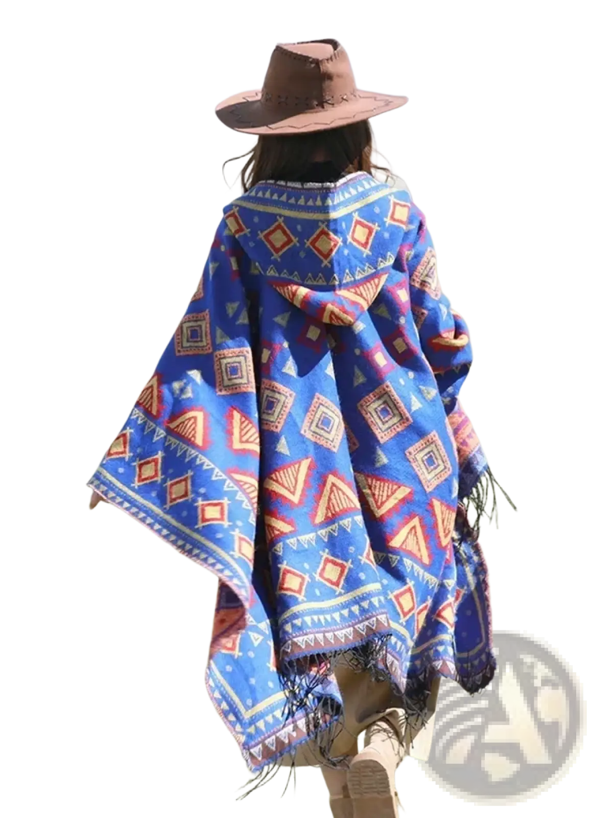 A vibrant blue knitted hooded poncho cape with red orange and white geometric patterns and fringed edges