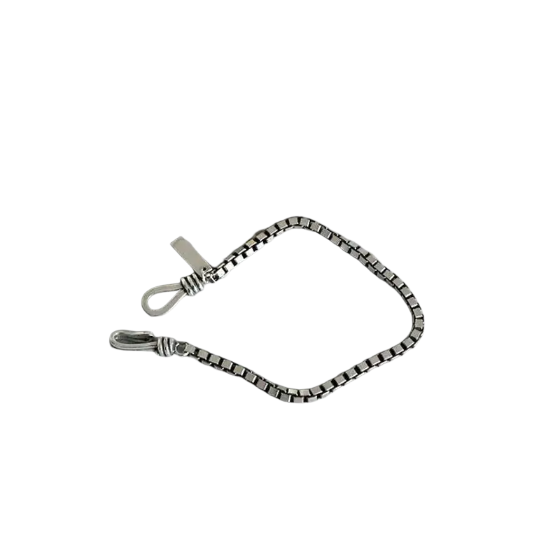Picture shows a silver-toned geometric metal charm bracelet for couples with a box chain and polished metal clasp