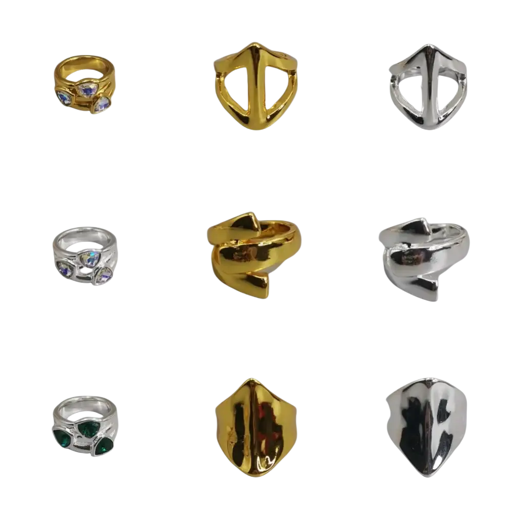 Geometric open ring featuring gold and silver metal with faceted gemstone accents in a modern design
