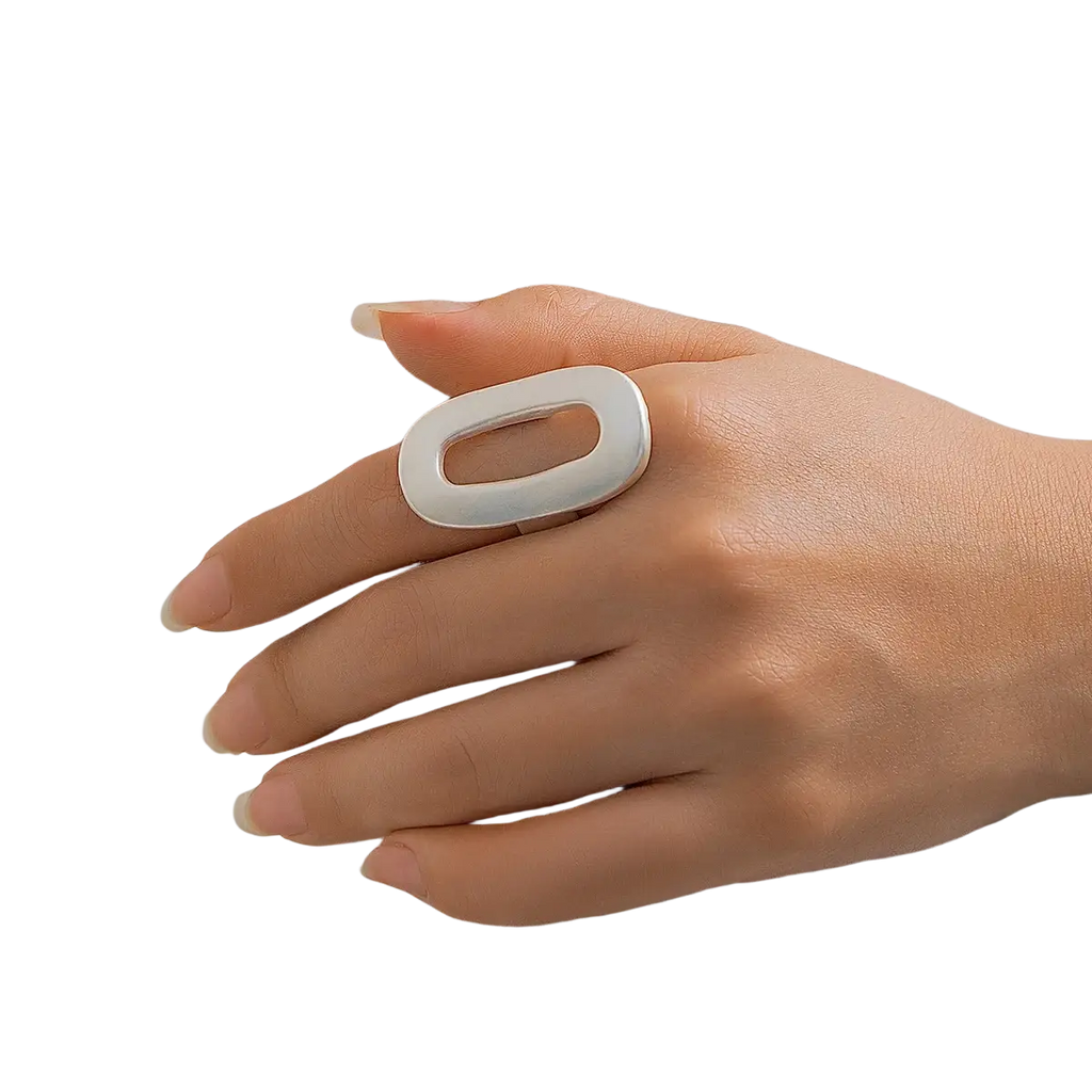 A sleek silver geometric oval open ring for women featuring a bold shape and central cutout design