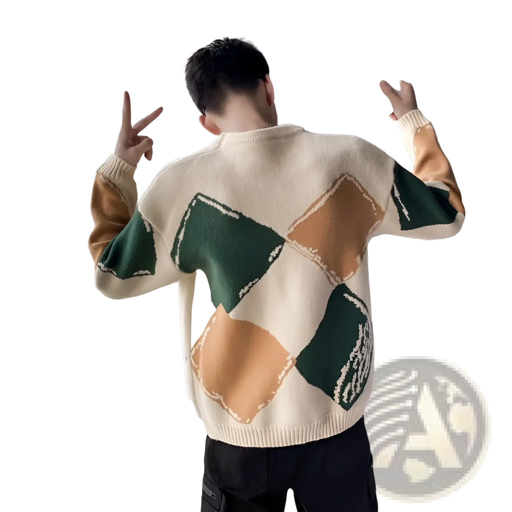 Cream-colored knit sweater for men with bold green and tan geometric blocks and ribbed neckline and cuffs