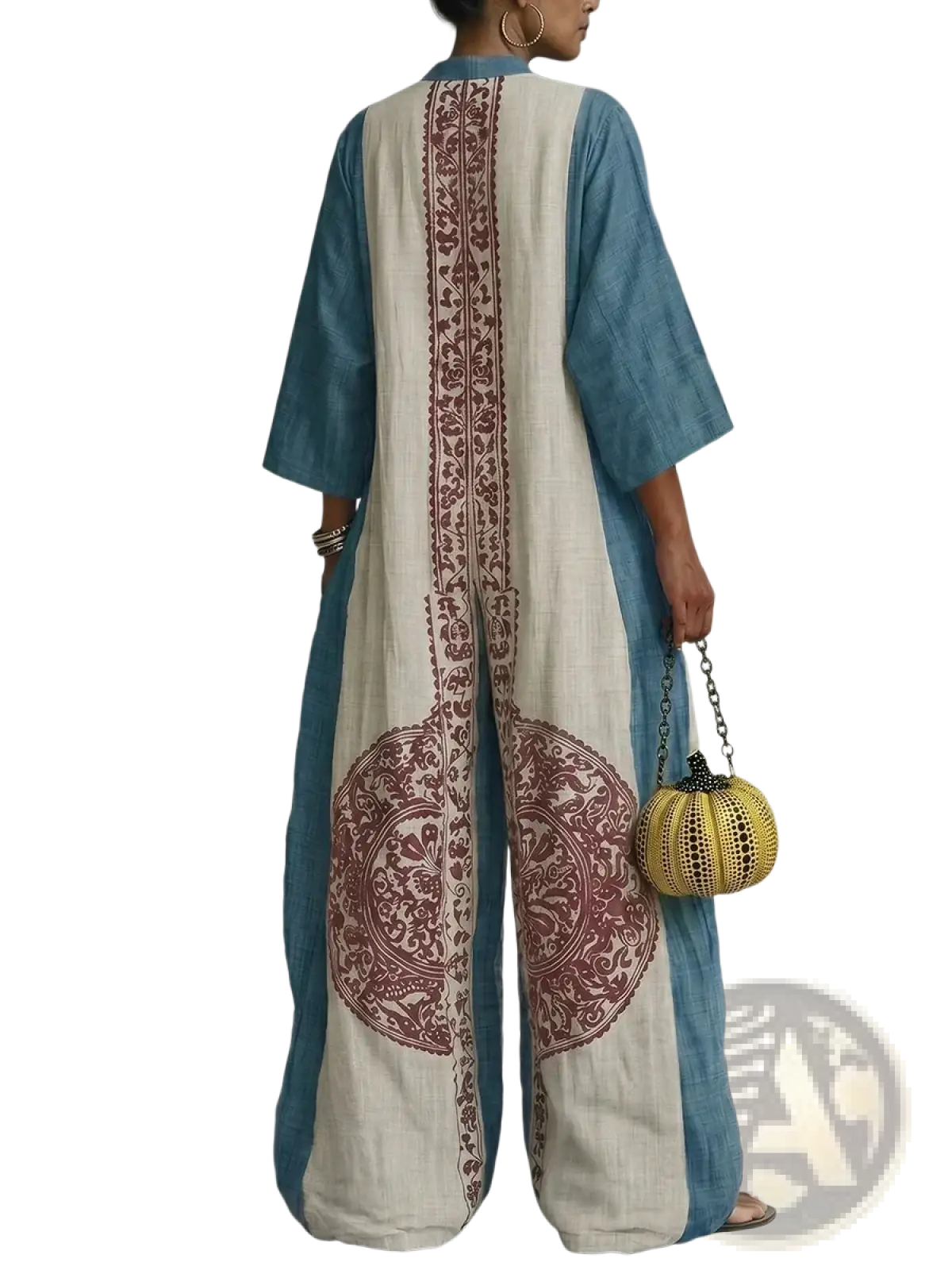 Back view of a blue and cream two-tone flowing kaftan with maroon embroidery in geometric print boho jumpsuit style