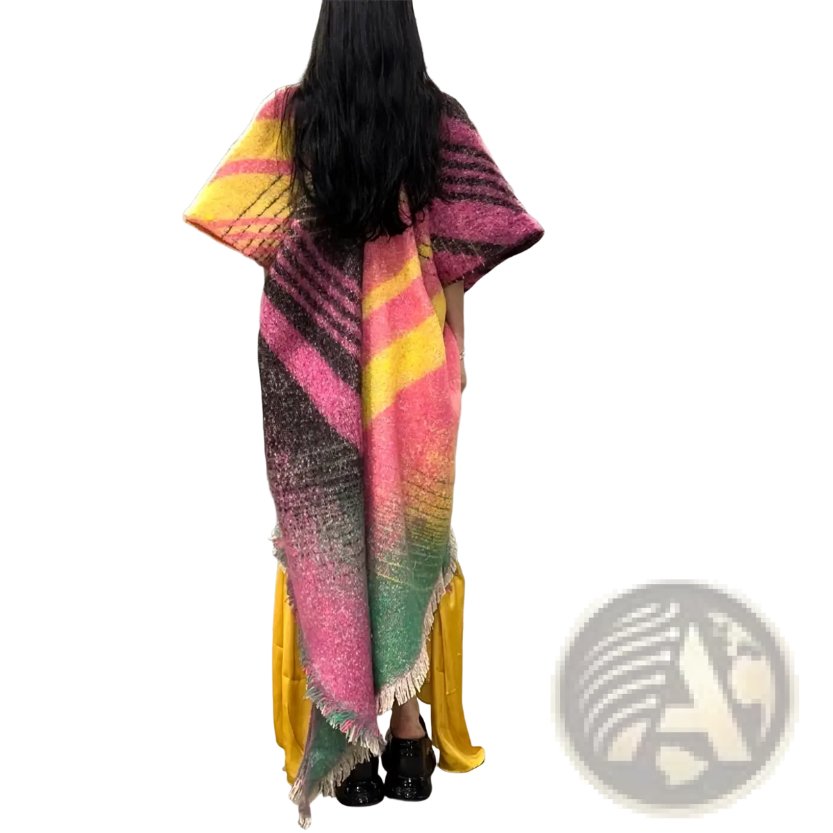 A vibrant oversized winyi poncho coat with bold pink yellow and green diagonal stripes and frayed edges