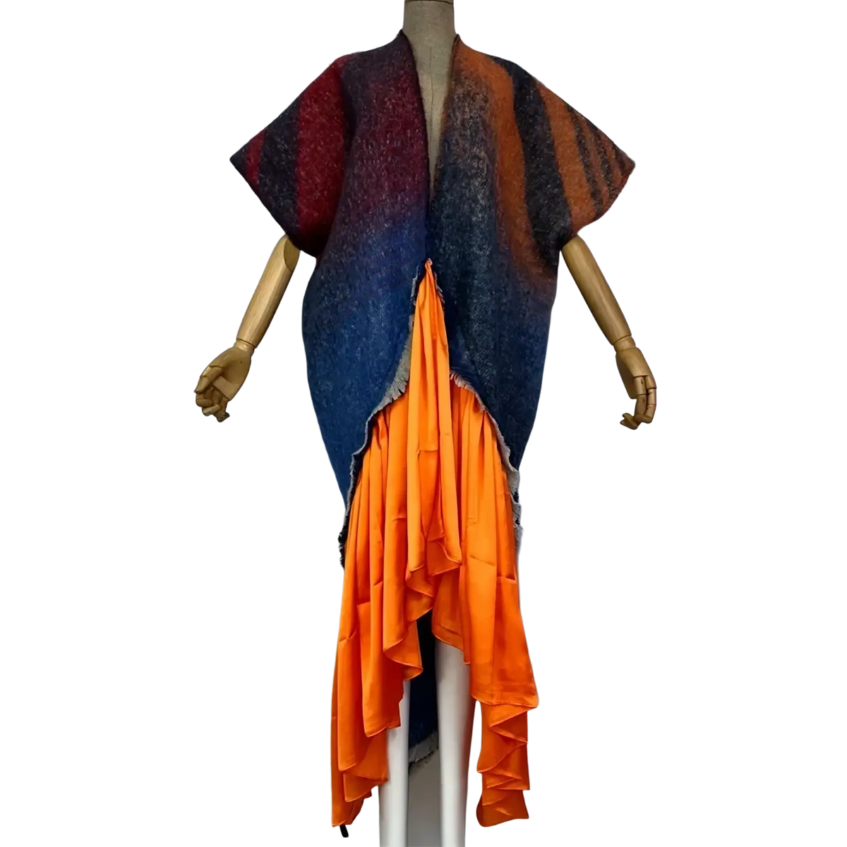 Winyi women’s asymmetrical knit cape with bold maroon orange navy stripes layered over vibrant orange ruffled panel