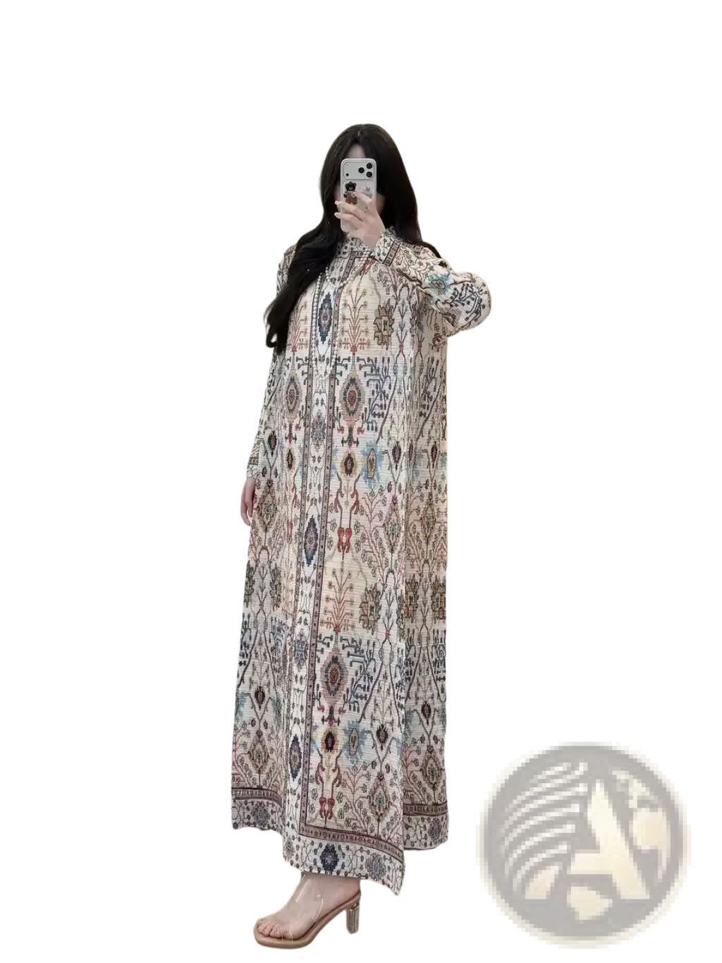 A flowing long-sleeved maxi dress in cream chiffon with geometric and floral print pleats
