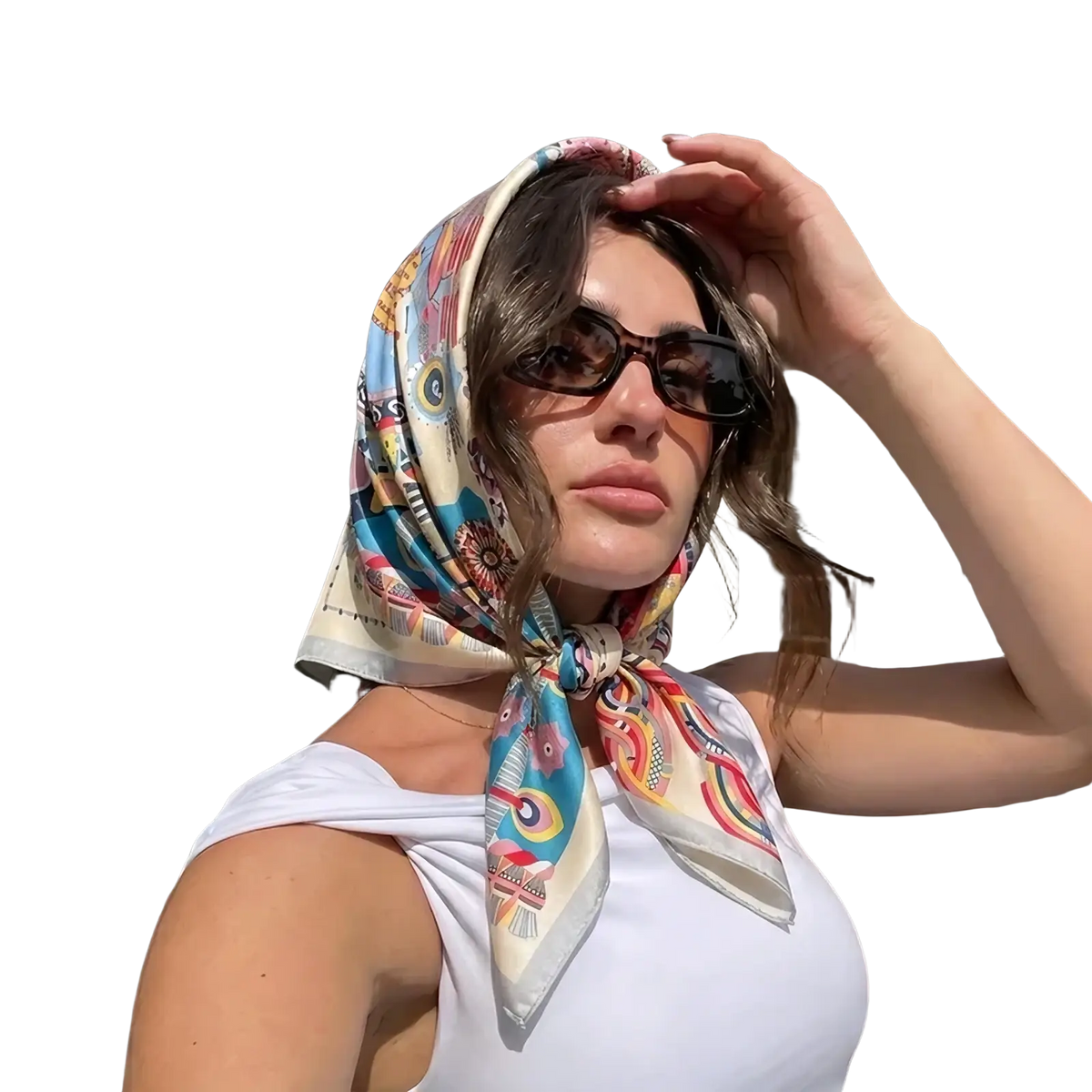 A vibrant geometric print satin square silk turban in blue red and beige tied around the head
