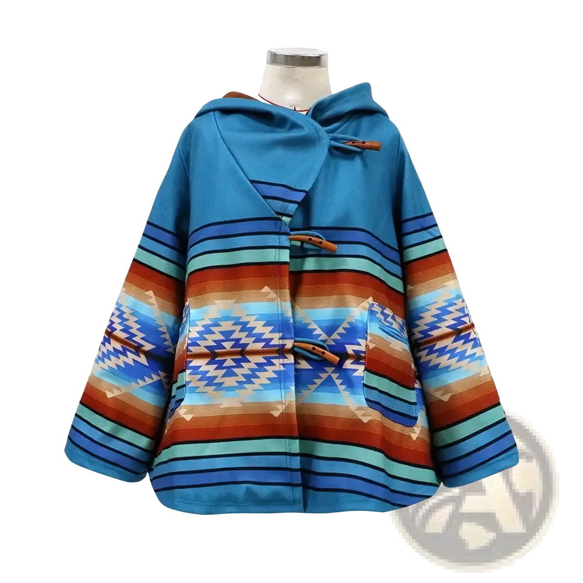 A vibrant blue woolen hooded coat with bold orange teal and white geometric stripes and zigzags