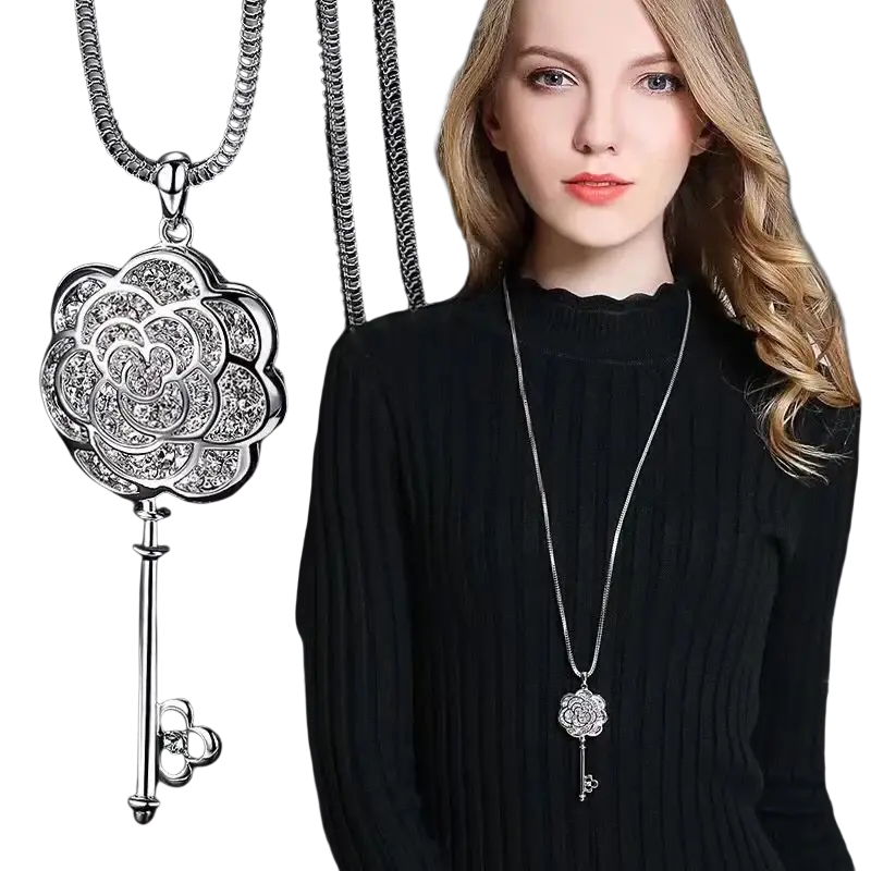 Silver rose key-shaped pendant necklace with intricate detailing and sparkling rhinestones in geometric style for women