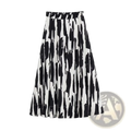 Geometric satin midi skirt featuring black and white abstract brushstroke pleated design in elegant satin material