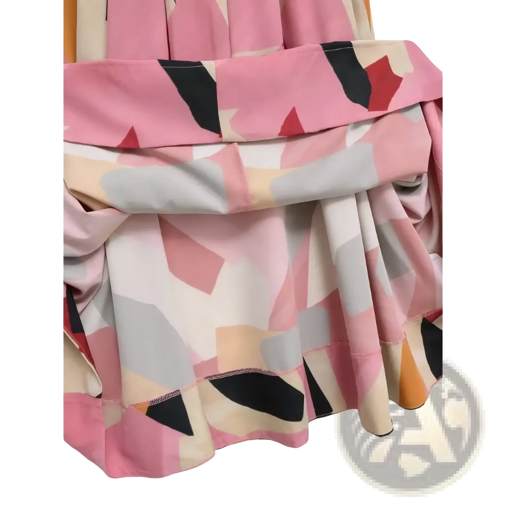Geometric satin midi skirt with a flowing abstract geometric print in shades of pink black beige and gray