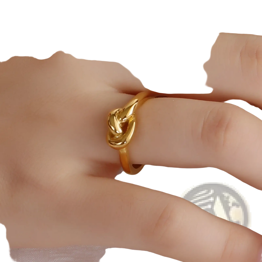 A sleek gold geometric truelove knot ring with a polished interwoven design made of titanium steel