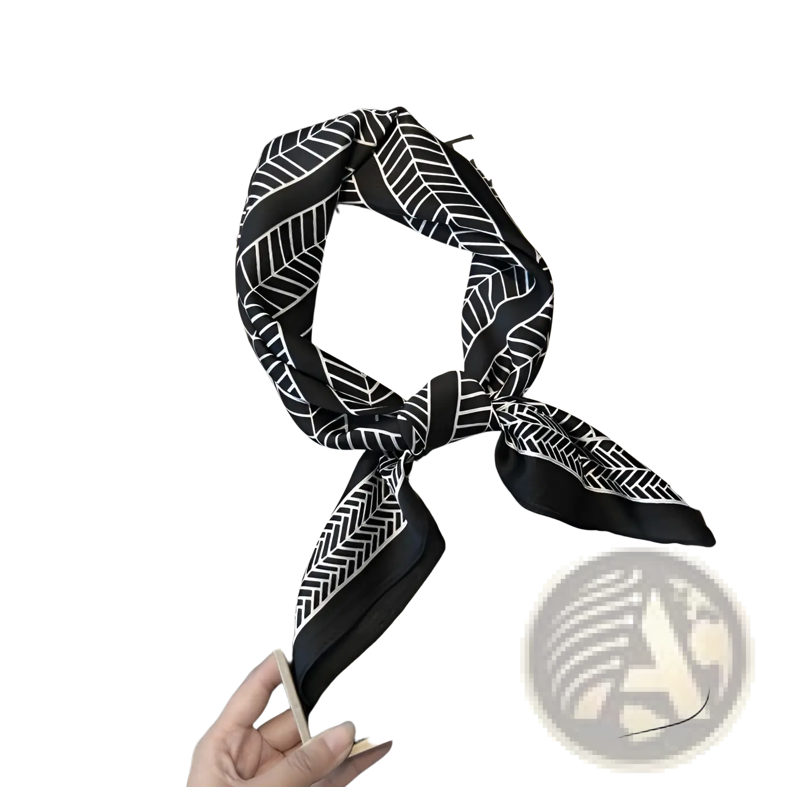 Black silk twill square scarf with white geometric leaf and herringbone patterns tied in a knot in a minimalist box