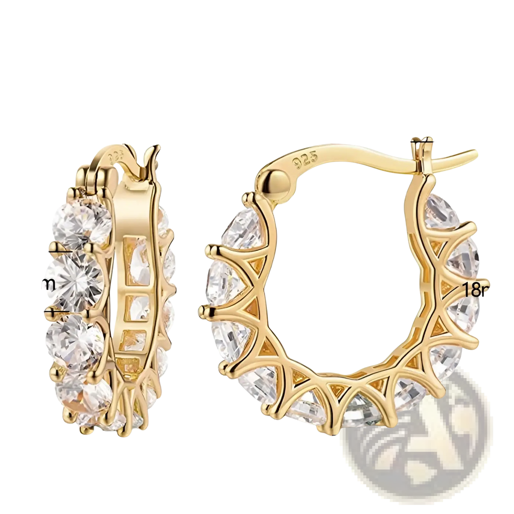 Gold-tone u-shaped hoop earrings with clear faceted zircon crystals in an intricate lattice design