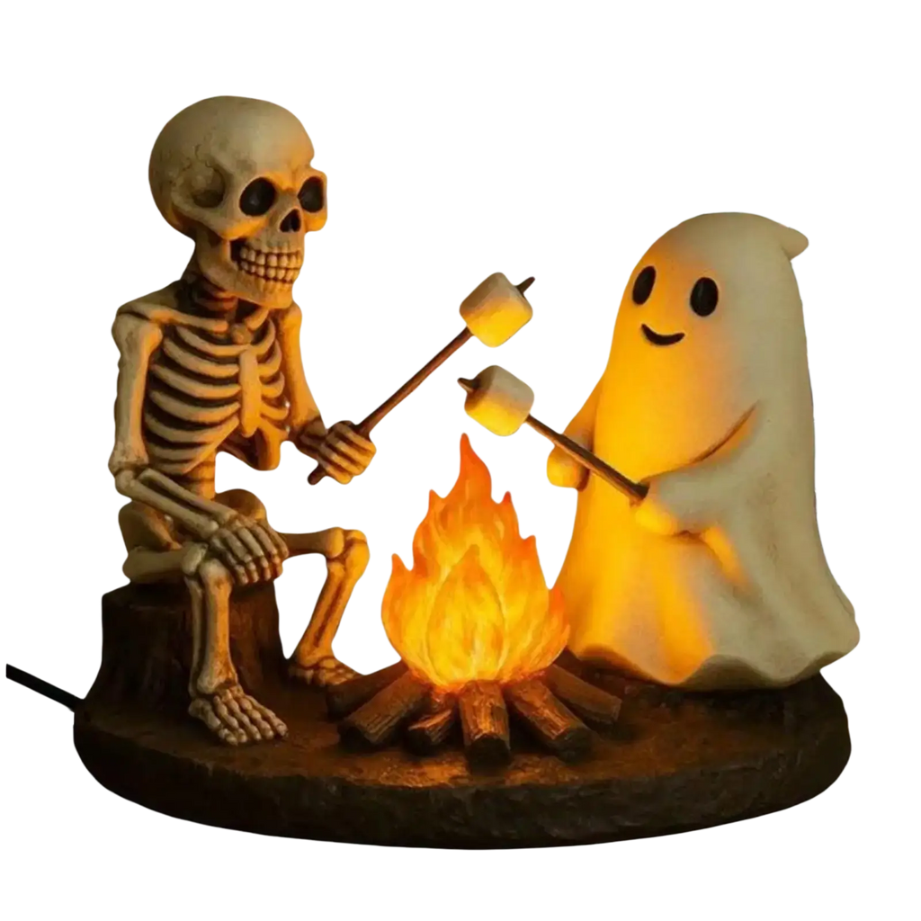 A ghost bonfire night lamp with a skeleton ghost roasting marshmallows in warm orange molded plastic lighting