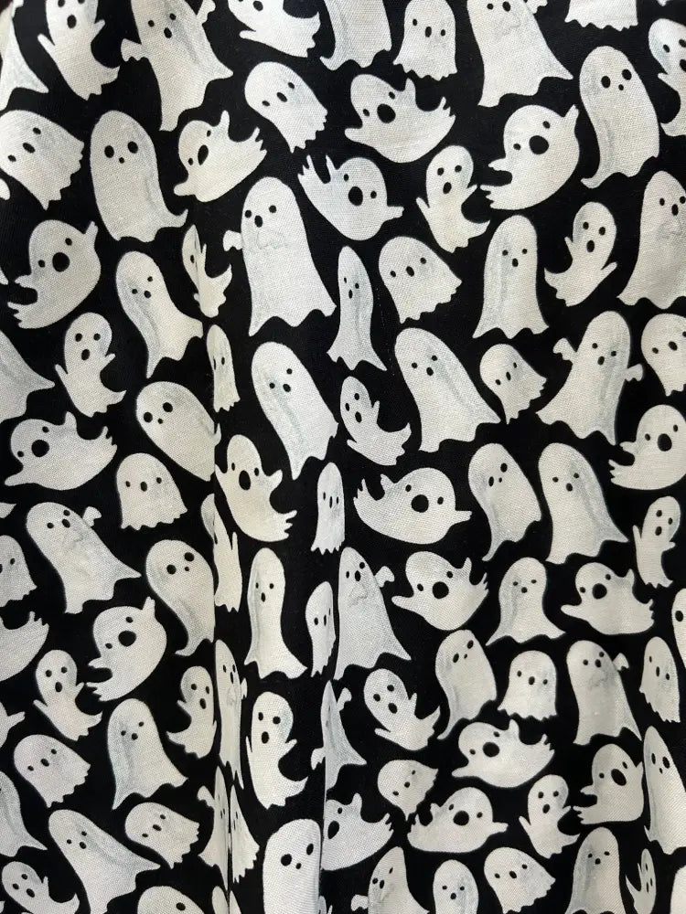 Vintage ghost print flared skater skirt in black fabric with a repeating pattern of white cartoon-style ghosts