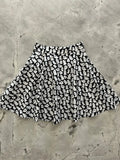 Black and white vintage ghost print flared skater skirt made of lightweight fabric for casual wear