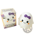 White ghost squishy slow rising stress relief toy with purple bow black eyes orange cheeks and smiling face
