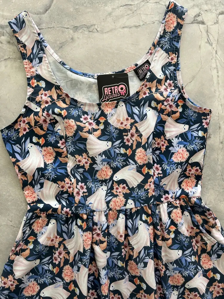 Navy blue cotton midi fit and flare dress with white ghost prints peach flowers scoop neckline and ruffled hem