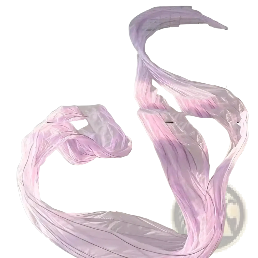 A giant gauze flower streamer backdrop decor featuring a flowing translucent lavender and pink gradient fabric sculpture suspended mid-air