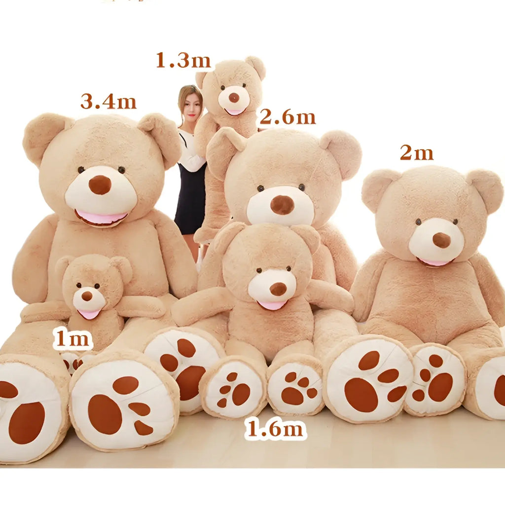 A collection of plush teddy bears in soft beige fur with white snouts and brown paw pads in various sizes