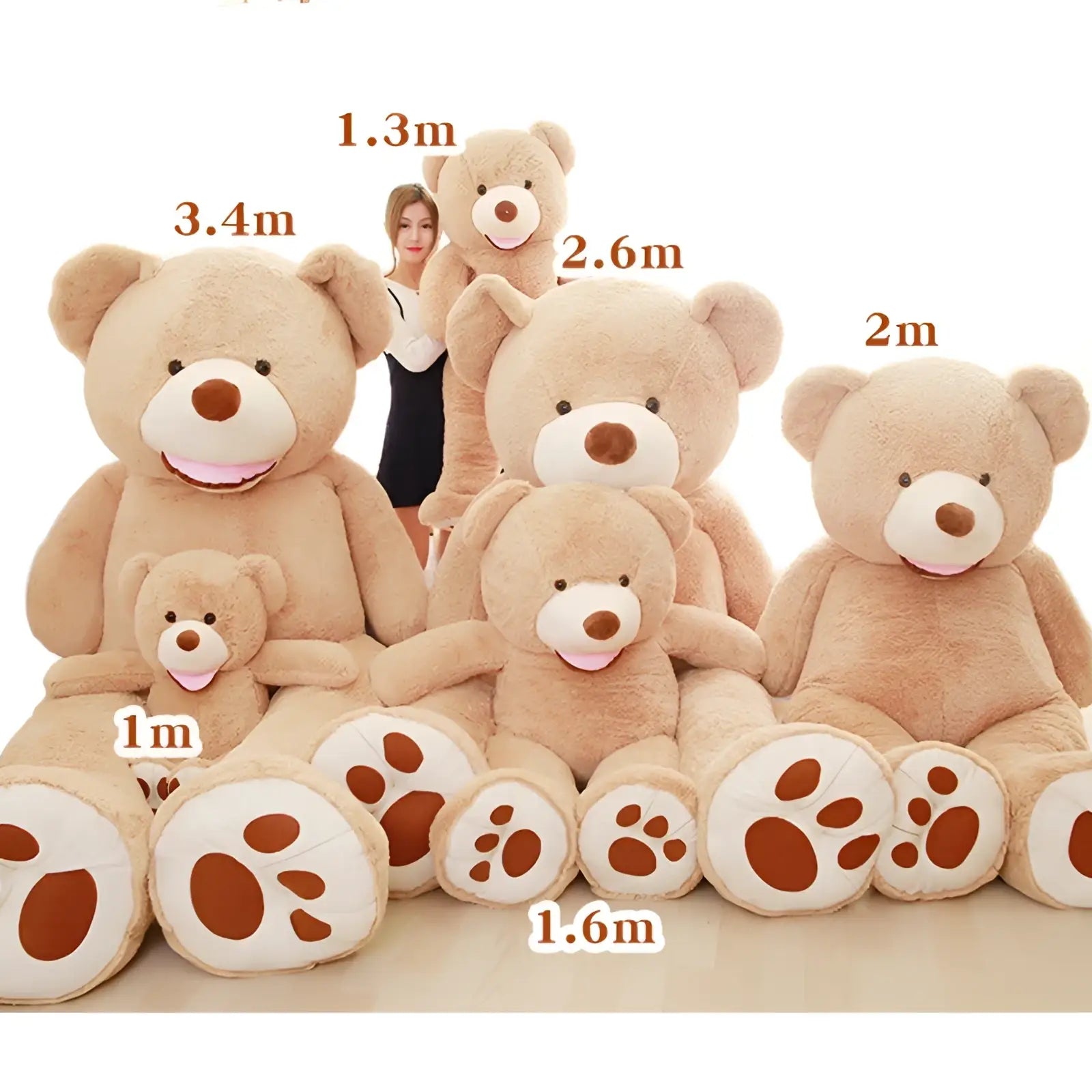 A collection of plush teddy bears in soft beige fur with white snouts and brown paw pads in various sizes