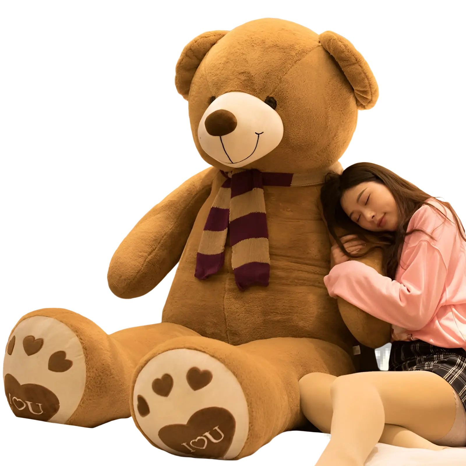 Giant tan teddy bear plush toy with white snout, brown nose, striped scarf, and heart paws spelling i love u