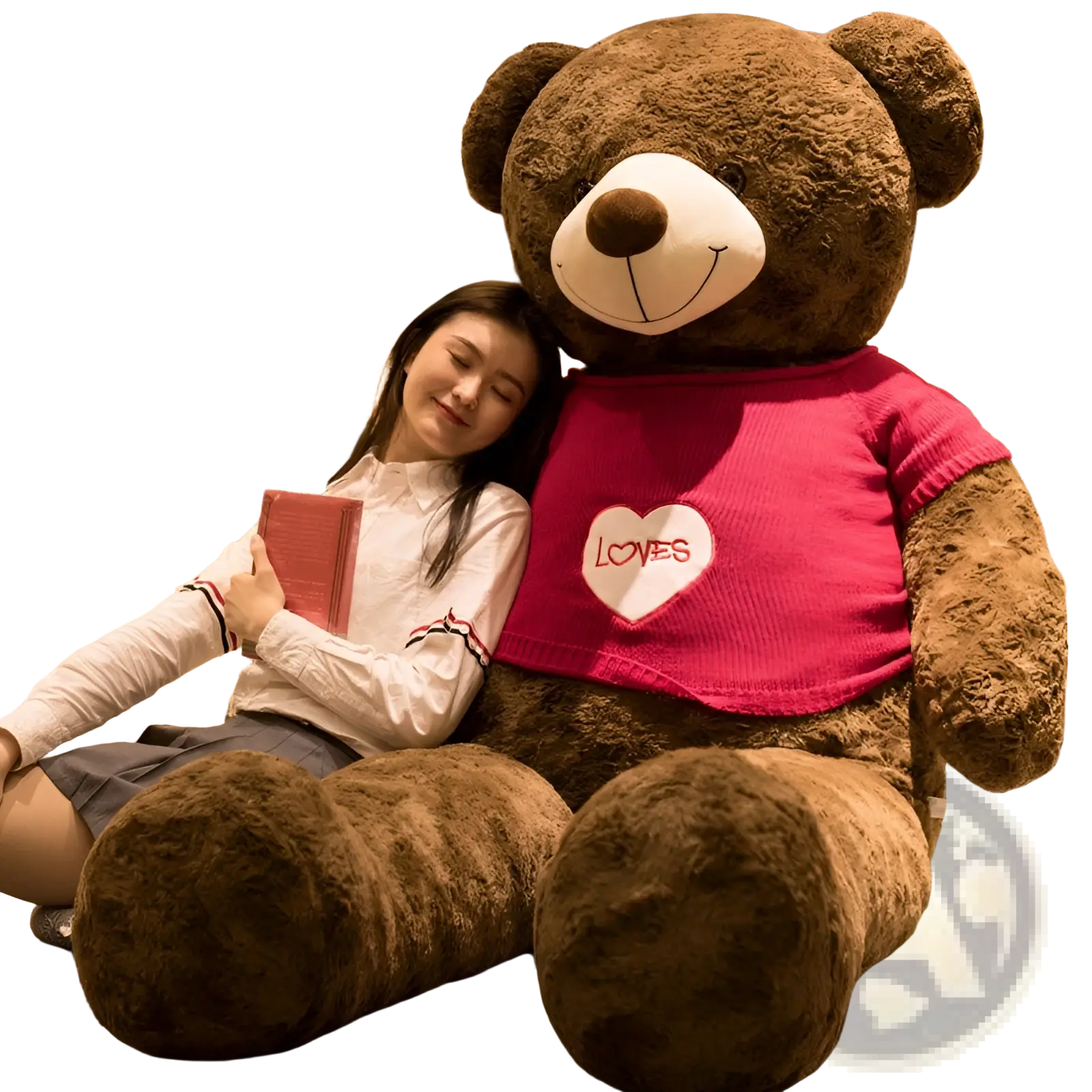 Giant brown plush teddy bear wearing a pink knitted sweater with a white heart and red loves lettering