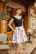 A white cotton a-line skater skirt with green christmas trees pink flamingos and red ornaments festive design