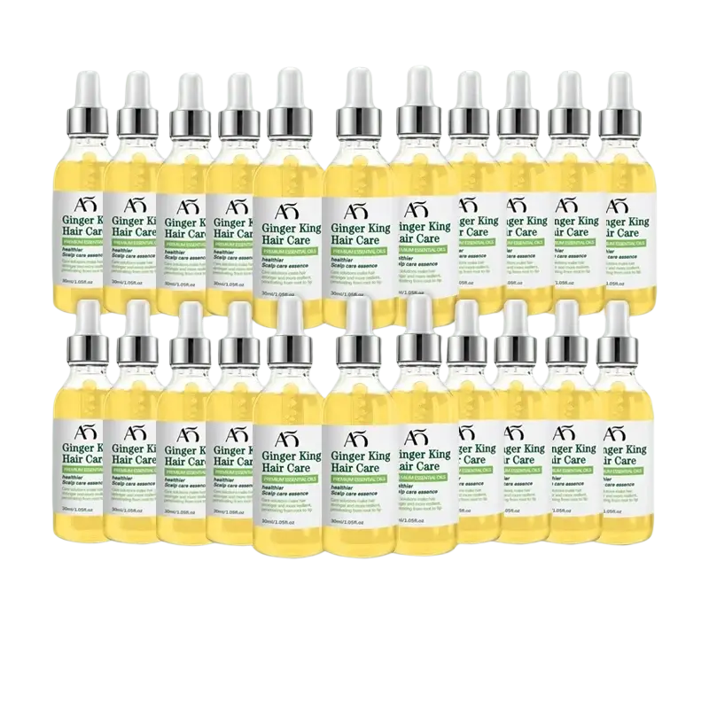 Clear glass bottles with silver droppers containing golden-yellow ginger king hair care essence for scalp growth serum