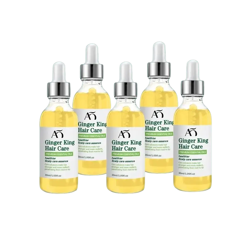 Five transparent glass bottles of Ginger King hair growth oil serum with golden-yellow liquid and silver dropper caps