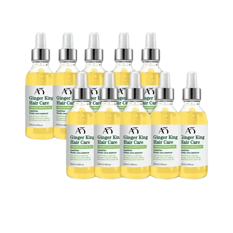Ten clear glass bottles of ginger hair growth oil scalp care serum with silver dropper caps and white green labels